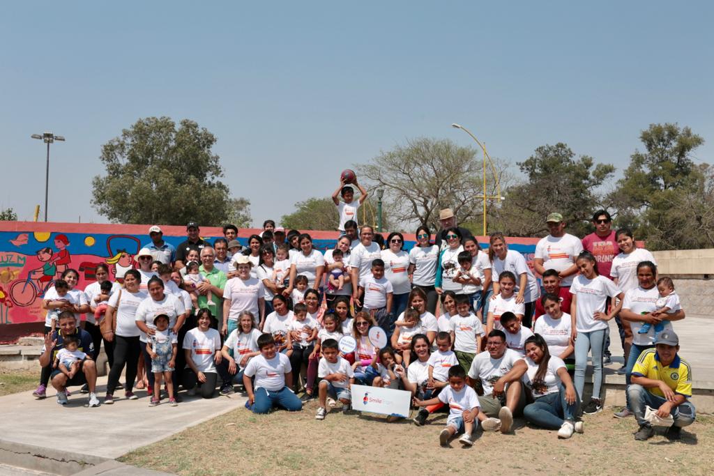 Silvia with a crowd of patients and their families