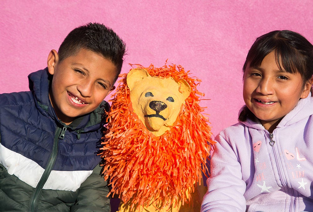 Alex and Kendra with a toy lion