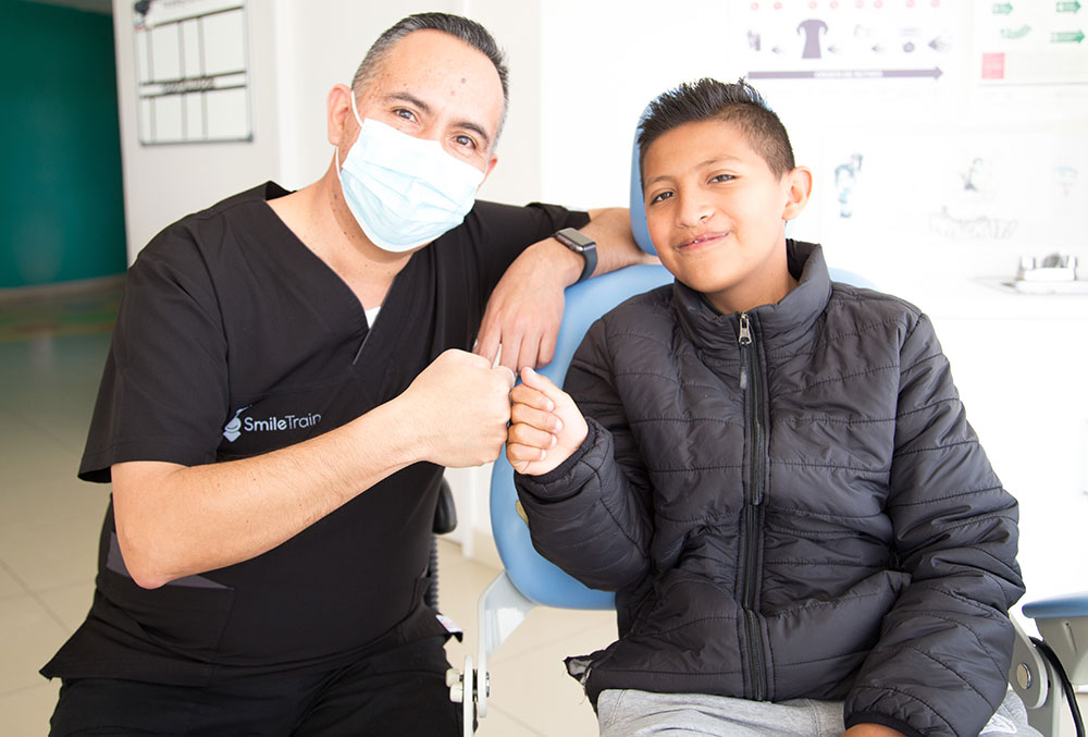 Alex smiles with Dr. eEduardo Varela