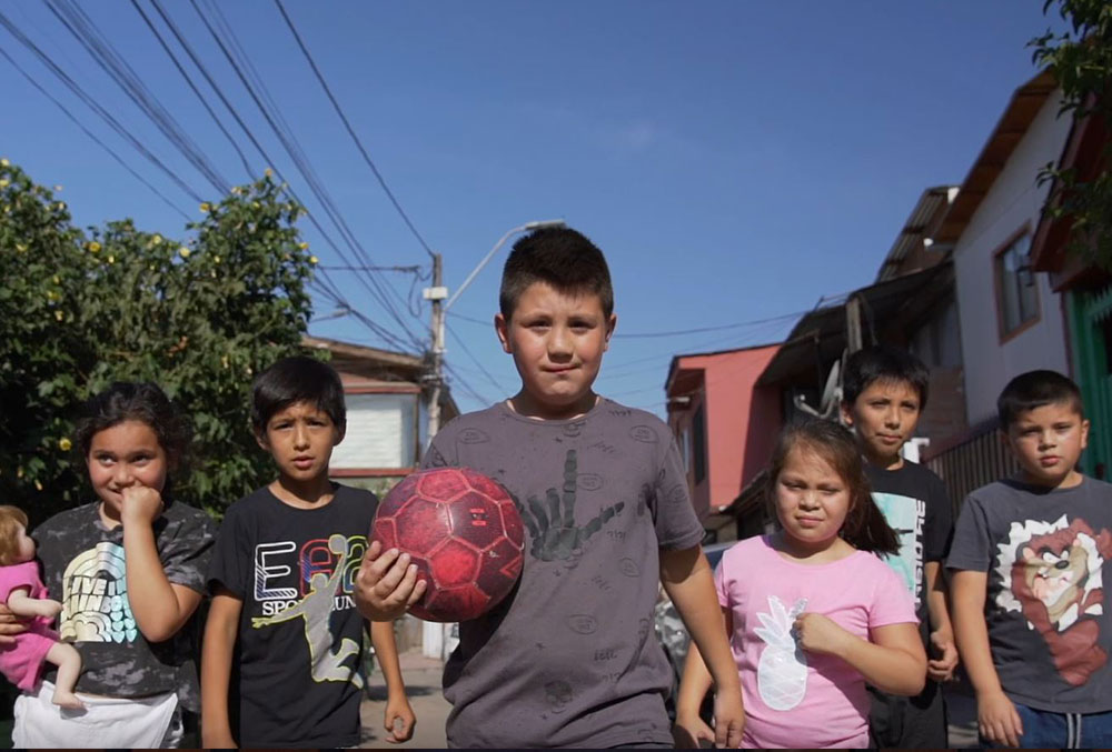 Amaro with his friends with a soccer ball