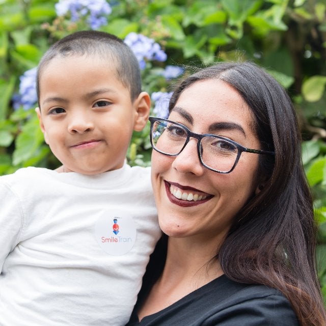 Andrea smiling holding a patient