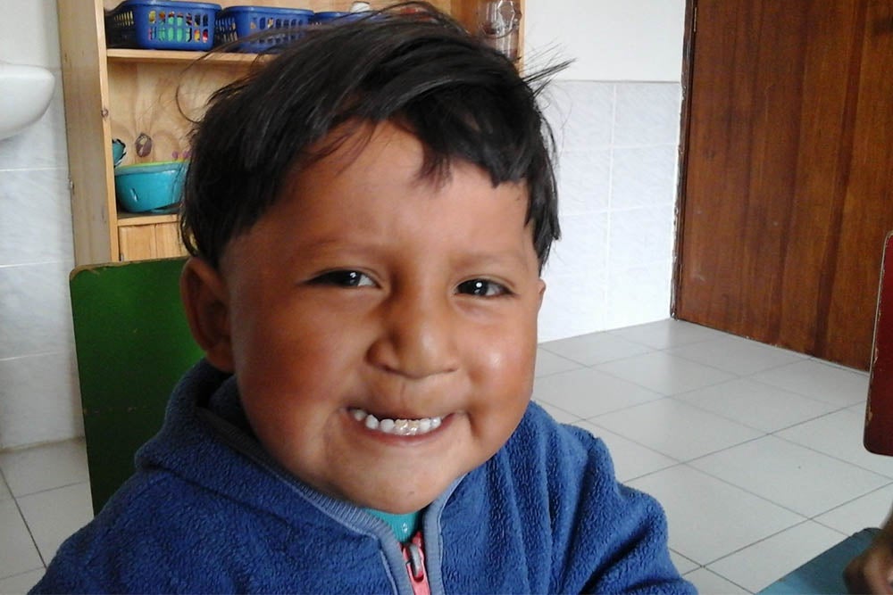 David smiling in a cleft speech therapy session