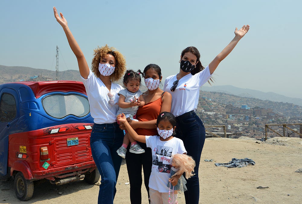 Elle and Yely with Jenifer, her mother, and her older sister