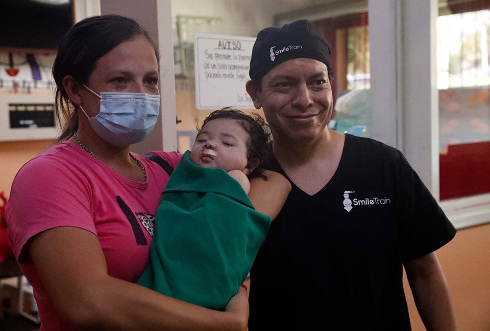 Cinthia, Gianna, and Dr. Aldana just after Gianna's cleft surgery