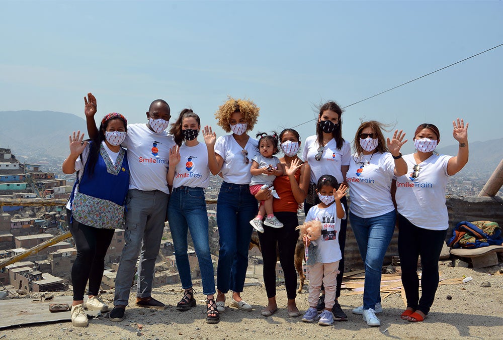 Smile Train and Miss Universe's Peru delegation with Jenifer and her mother