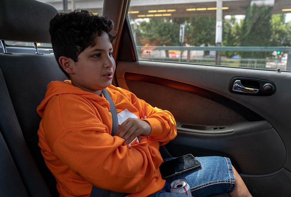 juan in a car after cleft surgery