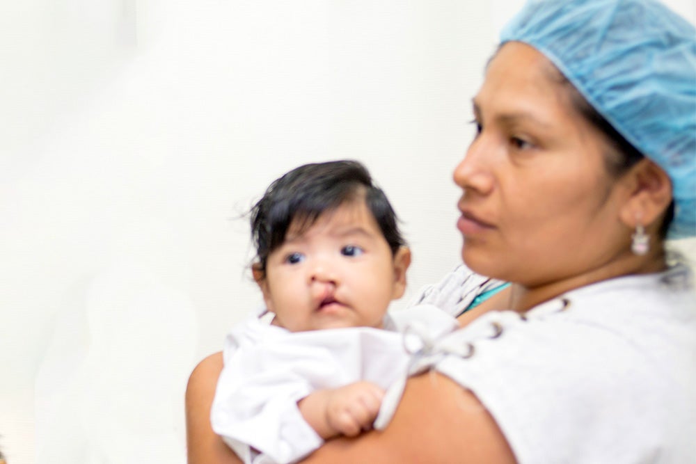 Luz holds Mia just before her surgery