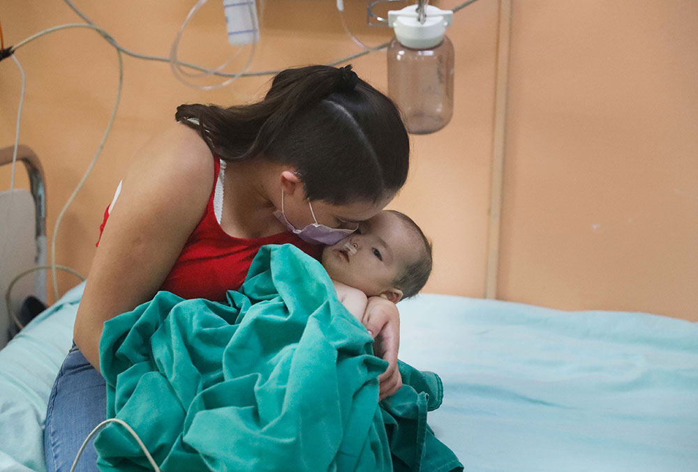 Rocio with Maxi immediately after his cleft surgery