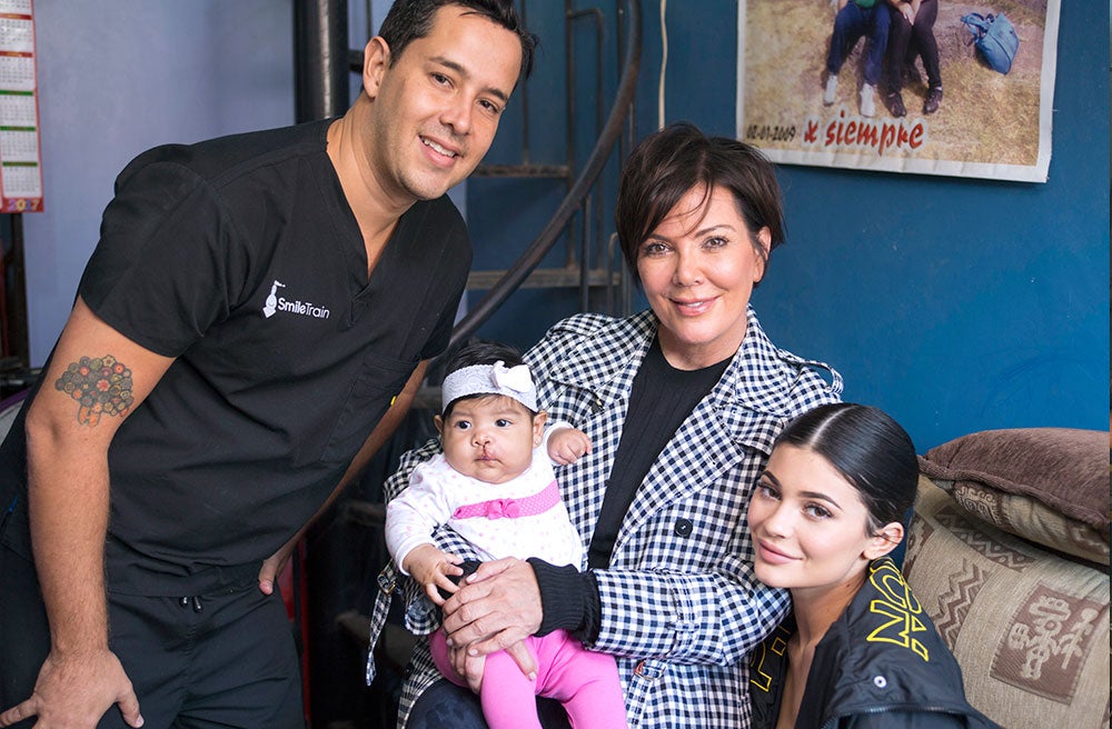 Kris Jenner holds Mia alongside Kylie Jenner and Mia's Smile Train's partner surgeon