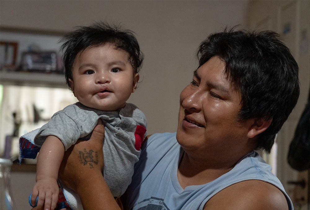 Miguel with his father, Jose, after surgery