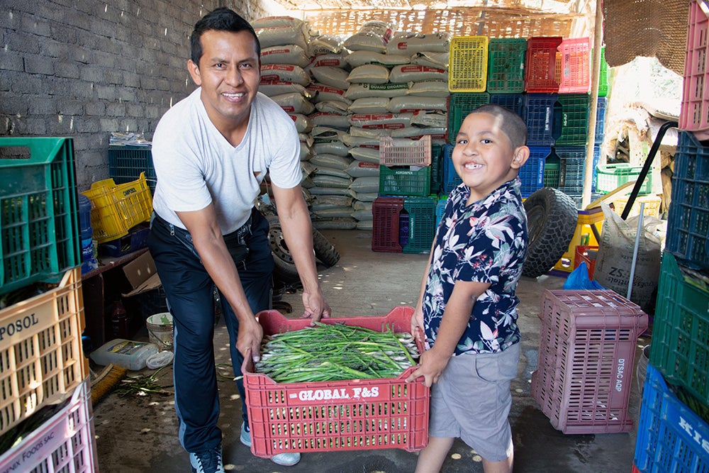 Ramses helping his father, Luis out