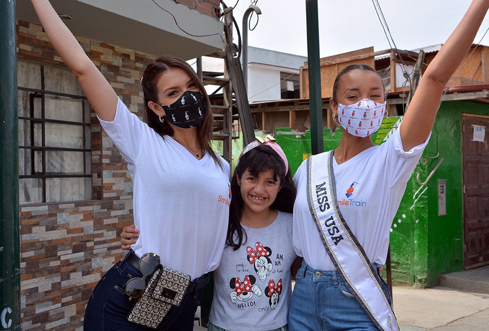 Estephany shares a smile with her two new best friends