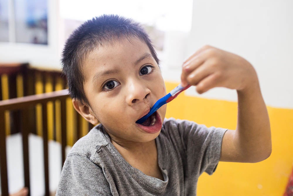 Auner brushing his teeth