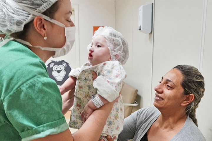 Nurse caring for cleft patient in Brazil