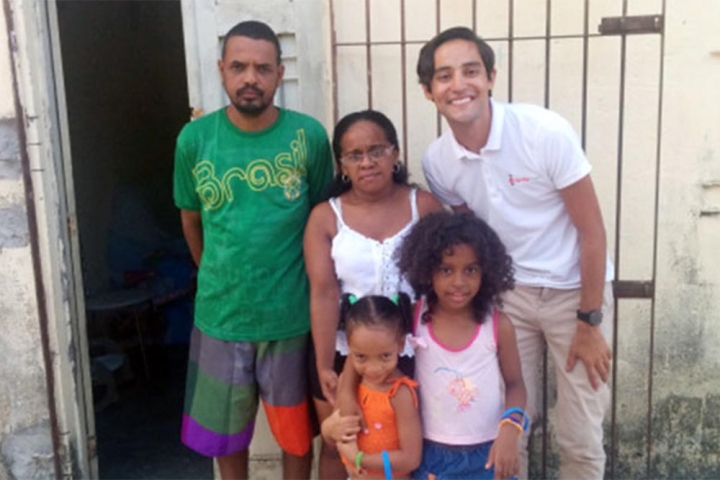 Jacob smiling with Maria Emanuela and her family