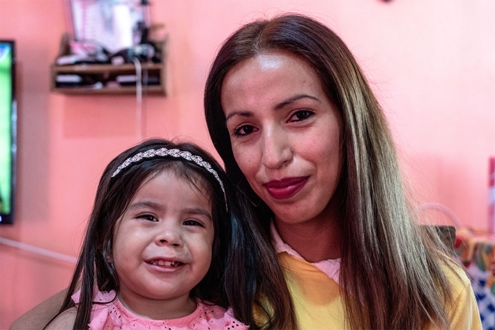 Isabella smiling with her mother Jenifer after her cleft surgery