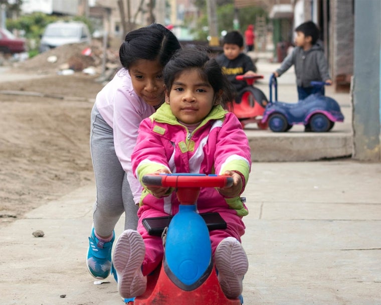 Mia riding a bike